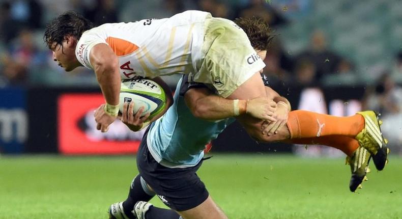 Central Cheetahs player Francois Venter is tackled during a Super Rugby match against the NSW Waratahs in Sydney in May 2016