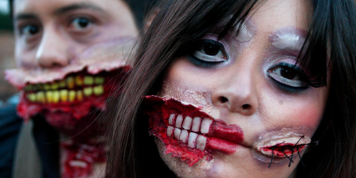 Participants take part in a "Zombie Walk" ahead of Halloween celebrations in Bogota.