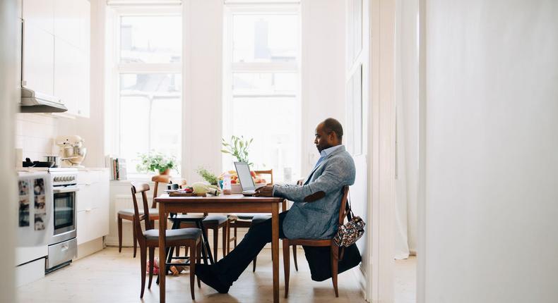 man using laptop at home