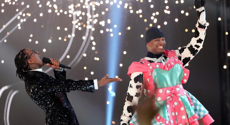 Nick Cannon celebrates Ne-Yo's win on The Masked Singer after he's unmasked as Cow.Michael Becker/Fox