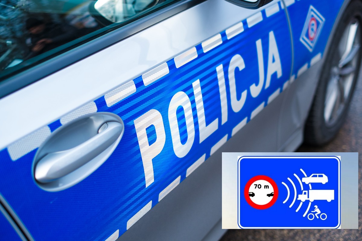 Radiowóz policyjny i nowy znak drogowy