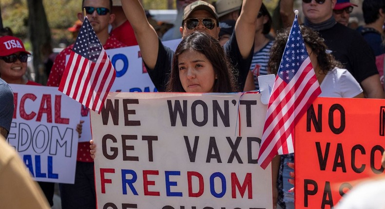 Anti-vaccination protesters pray and rally near Los Angeles City Hall in California on August 14, 2021.
