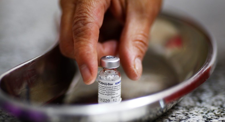 An Argentine nurse reaching for a dose of the Sputnik V vaccine during the first stage of the mass-vaccination campaign in El Palomar, Argentina, on February 18.
