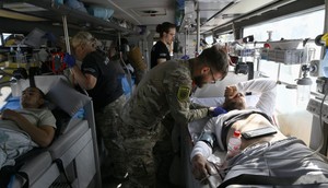 Paramedics checking on servicemen wounded in the Donetsk region of Ukraine.GENYA SAVILOV/ Getty Images