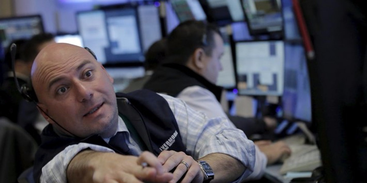 Traders work on the floor of the NYSE