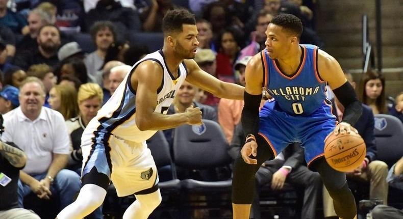 Russell Westbrook of the Oklahoma City Thunder dribbles past Andrew Harrison of the Memphis Grizzlies on April 5, 2017 in Memphis, Tennessee