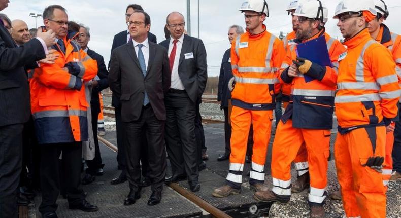 French President Francois Hollande attends the inauguration of the new Sud Europe Atlantique high-speed rail line, linking Tours and Bordeaux, on February 28, 2017, in Villognon, where two were injured when a police officer accidentally fired his gun