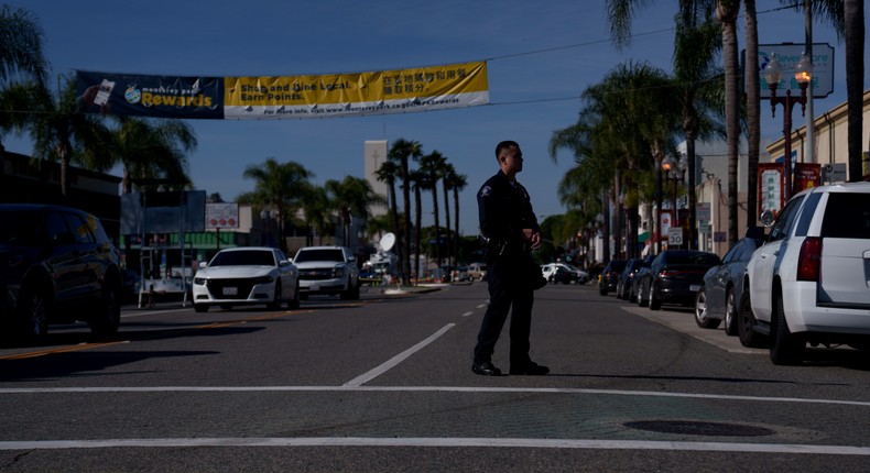 A member of law enforcement near the site of a deadly shooting on January 22, 2023 in Monterey Park, California. 10 people were killed and 10 more were injured at a dance studio in Monterey Park near a Lunar New Year celebration on Saturday night.Eric Thayer/Getty Images