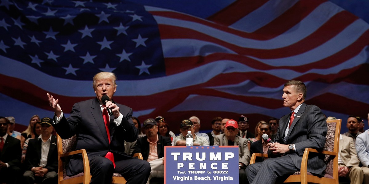 Republican presidential nominee Donald Trump (L) speaks along side retired U.S. Army Lieutenant General Mike Flynn during a campaign town hall meeting in Virginia Beach, Virginia, U.S., September 6, 2016.