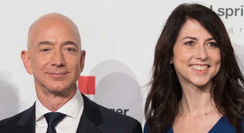 Amazon CEO Jeff Bezos and his now ex-wife MacKenzie Bezos poses as they arrive at the headquarters of publisher Axel-Springer where he will receive the Axel Springer Award 2018 on April 24, 2018 in Berlin.