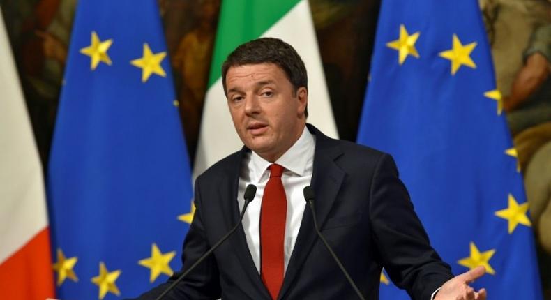 Italian Prime Minister Matteo Renzi gestures as he delivers a speech during a press conference at Palazzo Chigi in Rome ahead of a crucial referendum on constitutional reform