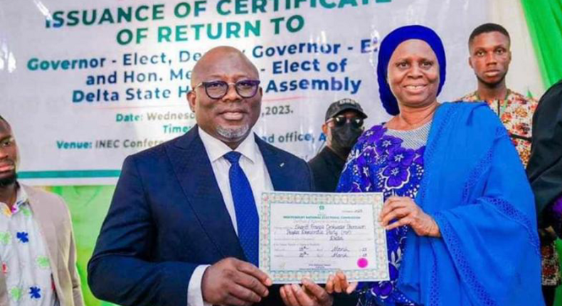 Delta Gôv. elect, Chief Sheriff Oborevwori receiving his certificate of return from INEC Nat. Commissioner, supervising Cross River, Delta and Edo States, Prof Rhoda Gumus on Wednesday in Asaba.