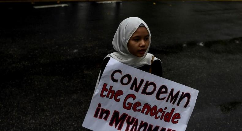 Protesters demonstrate in Kuala Lumpur against the treatment of Rohingya Muslims in Myanmar