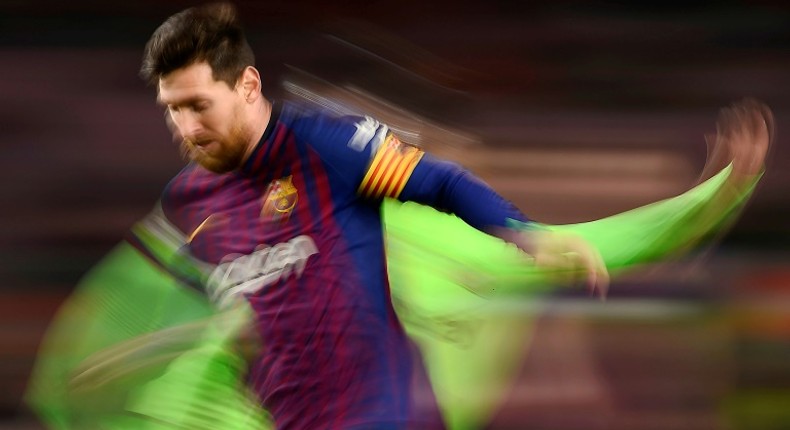 Lionel Messi ghosts past a Levante player