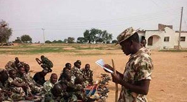 See photo of Nigerian soldiers observing their EID prayers on the battlefield