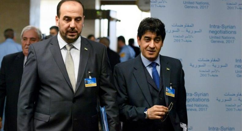 Syrian main opposition High Negotiations Committee (HNC) chief negotiator Mohamad Sabra (R) and leader Nasr al-Hariri arrive for a meeting with UN Special Envoy during Syria peace talks in Geneva on February 27, 2017