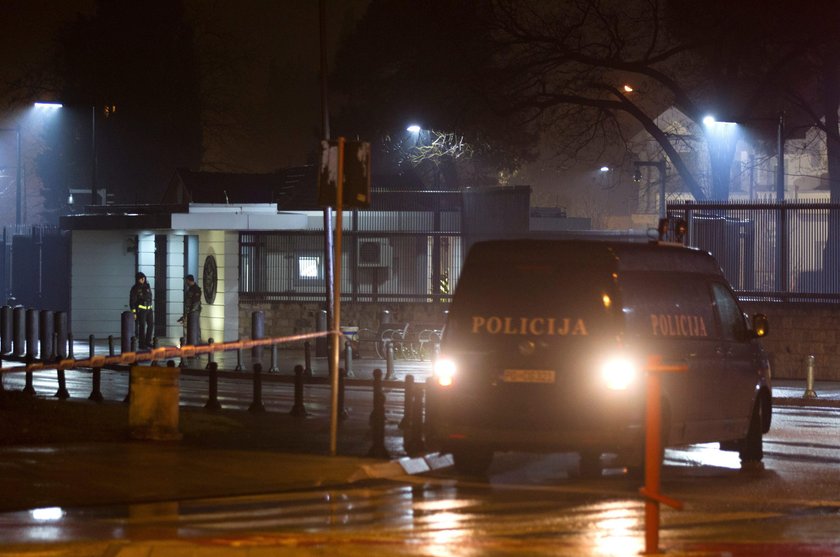 Police guard the entrance to the United States embassy building in Podgorica