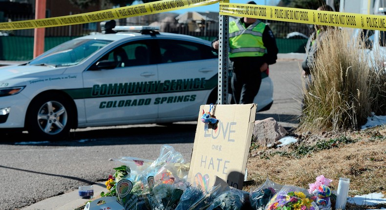 A bouquet of flowers is left near Club Q, an LGBTQ nightclub in Colorado Springs, Colorado, on November 20, 2022.(Photo by Jason Connolly / AFP)