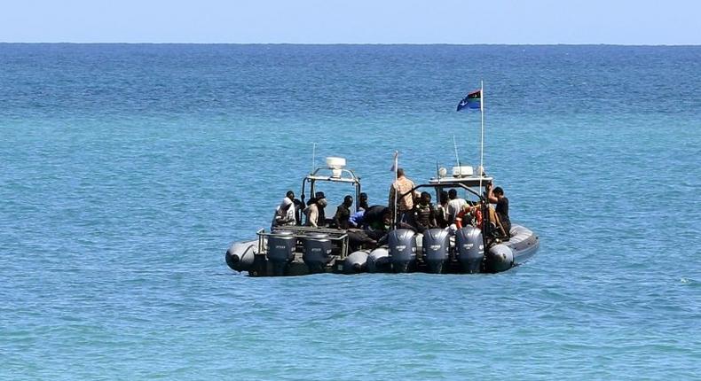 Migrants from Africa are seen after being rescued by Libyan coast guards rescued at sea, off the coastal town of Tajoura, 15 kilometres east of the capital Tripoli on May 23, 2017