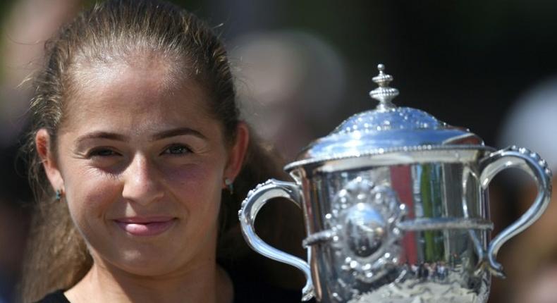 Latvia's Jelena Ostapenko poses with the French Open trophy on June 10, 2017