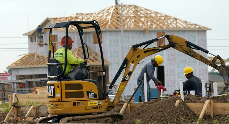 Construction workers build a new Centex home on Tuesday, June 23, 2020, in Houston.