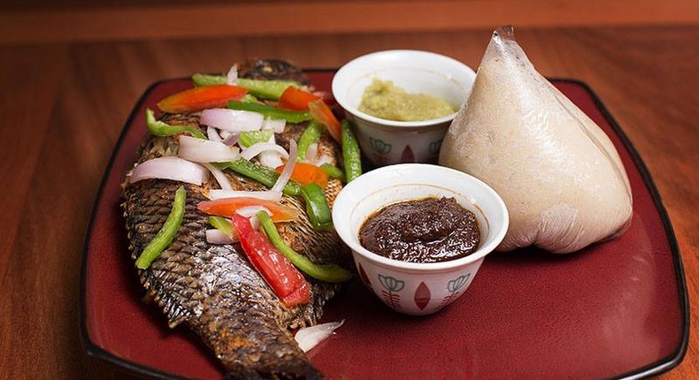 Banku and grilled tilapia with hot pepper