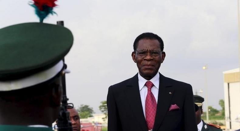 Equatorial Guinea's President Teodoro Obiang Nguema Mbasogo inspects a guard of honour upon his arrival at the presidential airport in Abuja, Nigeria May 28, 2015. 