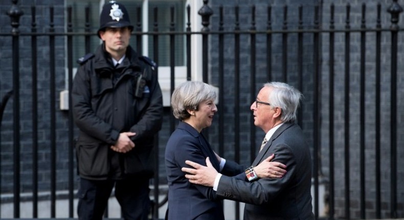 European Commission President Jean-Claude Juncker (R) is greeted by British Prime Minister Theresa May outside 10 Downing Street in London