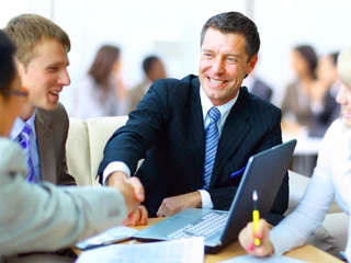 Business people shaking hands, finishing up a meeting