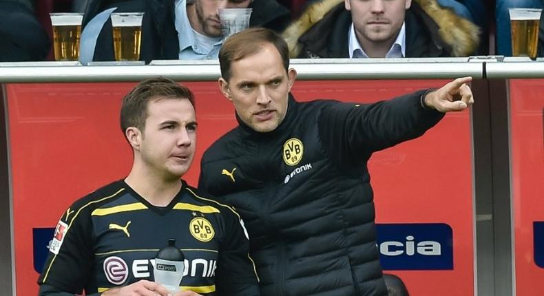 Dortmund's head coach Thomas Tuchel gives midfielder Mario Goetze instructions on October 22, 2016