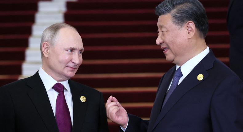 Russian President Vladimir Putin and Chinese leader Xi Jinping interacting during a welcoming ceremony at the Third Belt and Road Forum in Beijing on October 17, 2023.Sergei Savostyanov/Pool/AFP/Getty Images