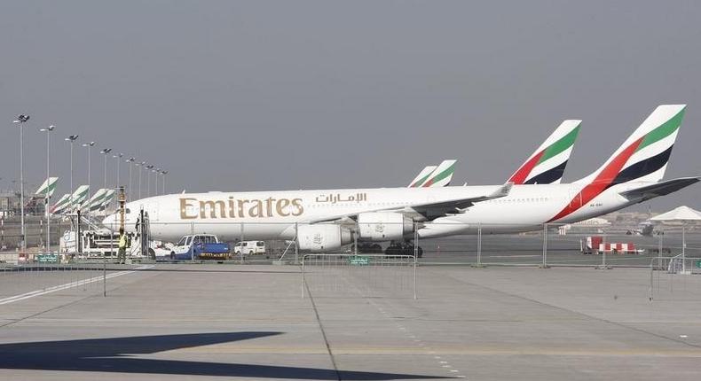 Emirates Airlines planes are parked at the Dubai International Airport during the second day of the Dubai Airshow November 14, 2011. 