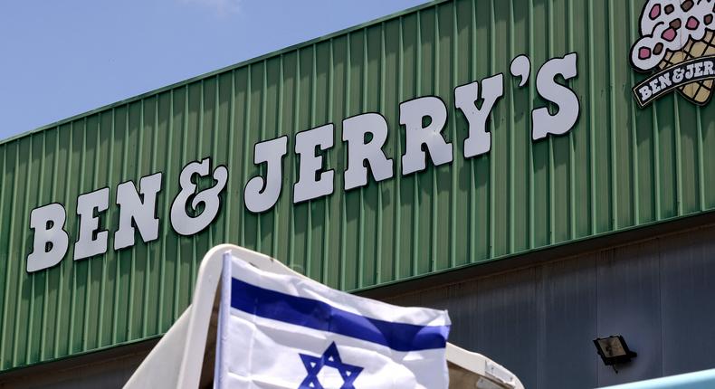 An Israeli flag is set atop a delivery truck outside US ice-cream maker Ben & Jerry's factory in Be'er Tuvia, on July 21, 2021
