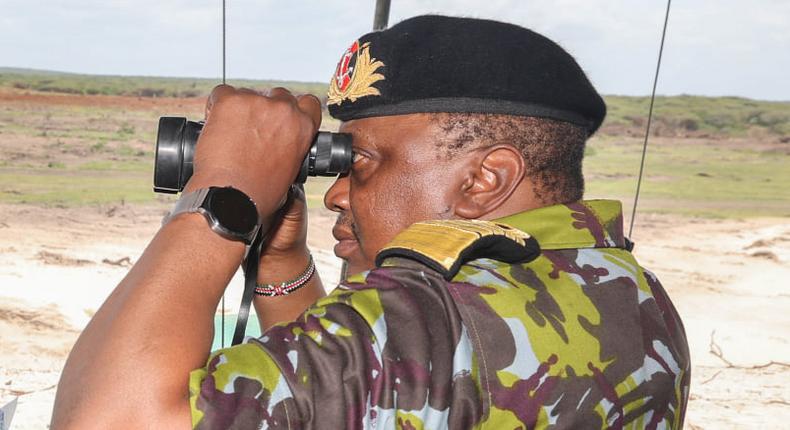 President Uhuru Kenyatta watching Kenyan security officers undertaking a joint operational training in Boni Forest, Lamu County.
