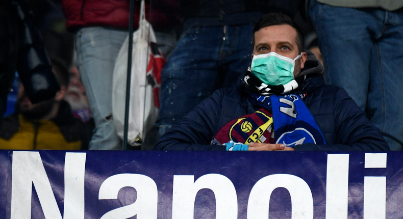 NAPLES, CAMPANIA, ITALY - 2020/02/25: Fan wearing masks for fear of coronavirus infection (COVID-19) at the San Paolo Stadium in Naples, during the football match UEFA Champions League, SSC Napoli vs FC Barcelona. (Photo by Salvatore Laporta/KONTROLAB/LightRocket via Getty Images)