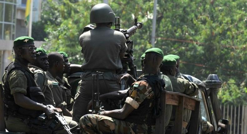 Guinean soldiers, similar to these pictured in 2010, opened fire ona group of men leaving a house in Conakry, killing two of them