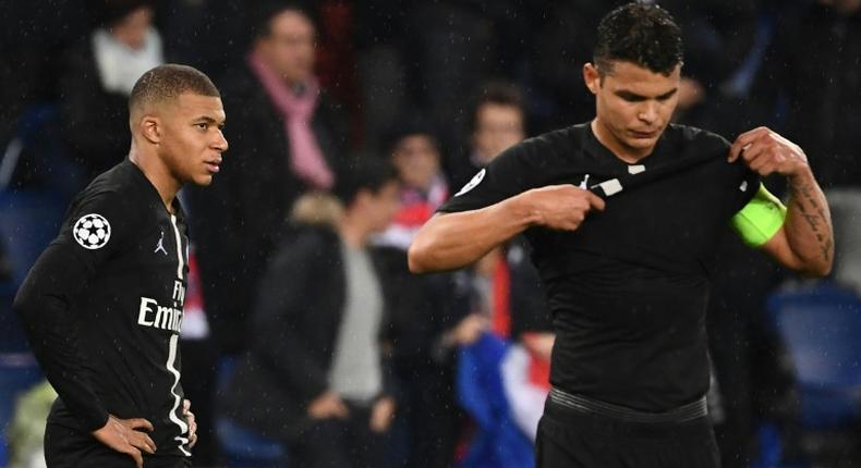 Kylian Mbappe (L) and Paris Saint-Germain captain Thiago Silva in disbelief after their side's Champions League exit against Manchester United on Wednesday