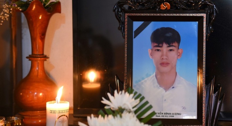 A portrait of 20-year-old Nguyen Dinh Luong, who is feared to have been among the 39 people found dead in a truck in Britain, is kept on a prayer altar at his house in Vietnam's Ha Tinh province on October 29, 2019