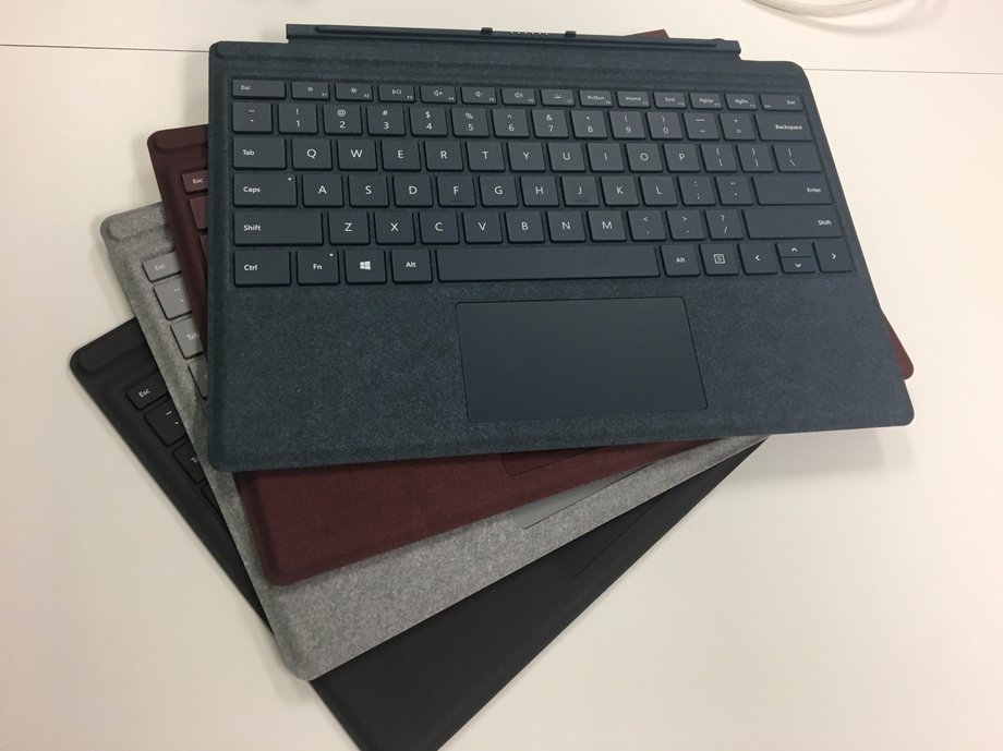 The new colors of Surface Pro Signature Type Cover. These high-end models are covered in alcantara fabric and go for $159 a pop — but they turn the Surface Pro into a proper laptop.