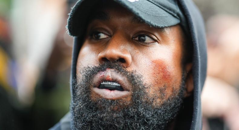 Ye, who is also known as Kanye West, is seen wearing a Balenciaga boxing mouthguard, outside Givenchy, during Paris Fashion Week.Edward Berthelot/GC Images