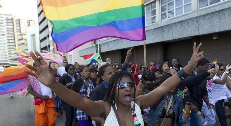 A file photo of a woman holding her hands up during the Durban Pride parade where several hundred people marched through the Durban city centre in support of gay rights. REUTERS/Rogan Ward
