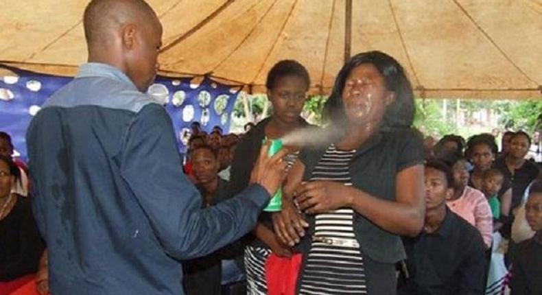 Prophet Lethebo Rabalago using insecticide to heal his members