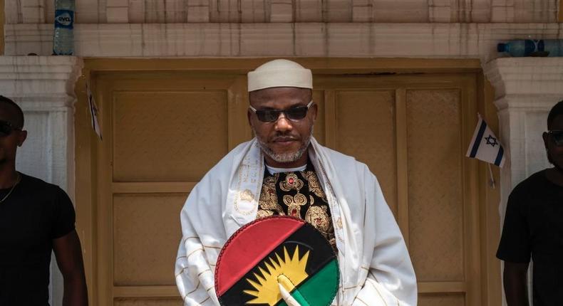 Political activist and leader of the Indigenous People of Biafra (IPOB) movement, Nnamdi Kanu (L), wearing a Jewish prayer shawl, poses in the garden of his house in Umuahia, southeast Nigeria, on May 26, 2017, before commemoration of the 50th anniversary of the war on May 30. (Photo by STEFAN HEUNIS/AFP via Getty Images)