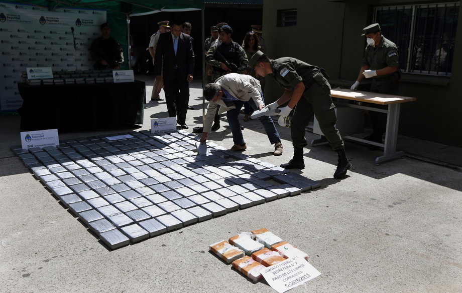 Officers from the National Gendarmerie inspect packages of cocaine to be burnt at their headquarters in Buenos Aires, March 10, 2014.