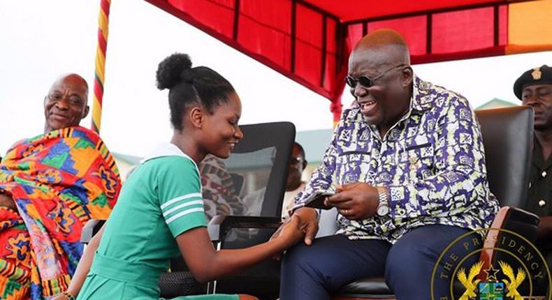 Nana Addo with a nurse