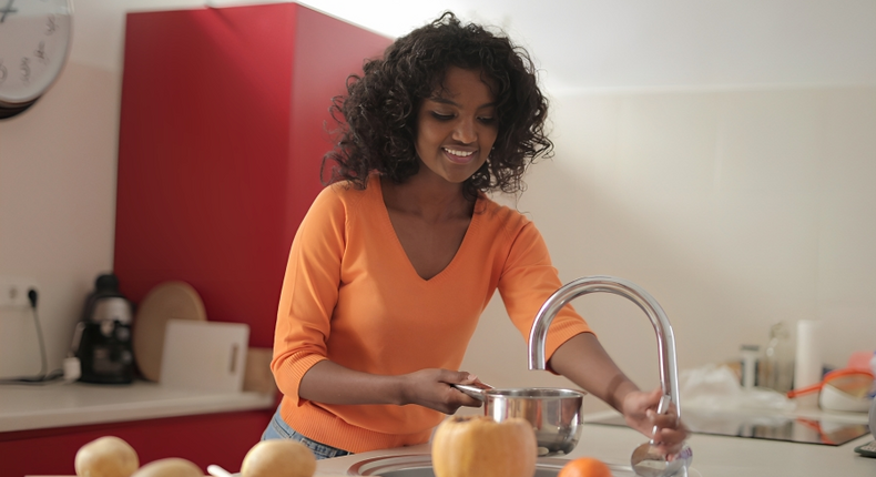 A lady using the kitchen