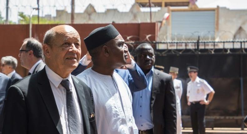 French Foreign Affairs Minister Jean-Yves Le Drian, left, with Burkina Faso's Foreign Affairs Minister Alpha Barry at the inauguration of an education and start-up incubator in Ouagadougou on October 19, 2018