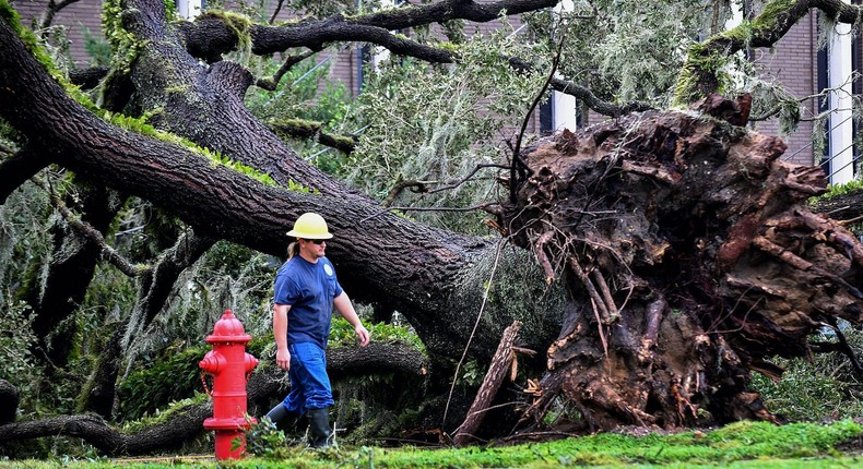 A worker repairs energy lines during a power outage after Hurricane Ian passed through the area on September 29, in Bartow, Florida. The hurricane brought high winds, storm surge and rain to the area causing severe damage.