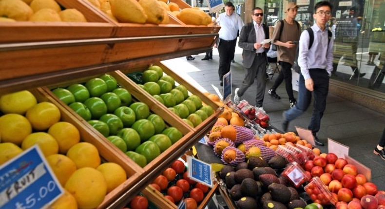 A fruit vendor tends to his stall in Sydney's central business district on November 29, 2016