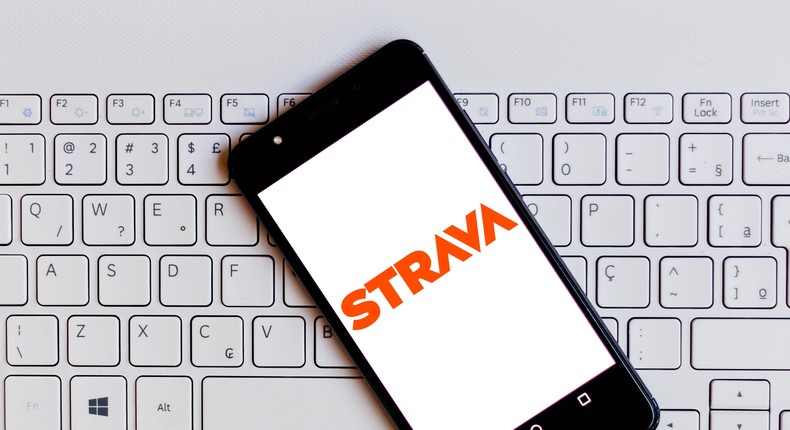 In this photo illustration, the Strava logo is seen displayed on a smartphone.